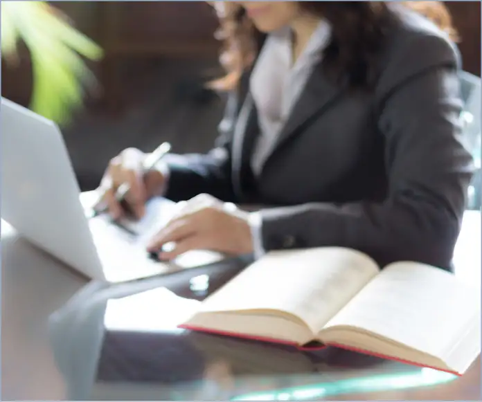 A woman working on an office with a computer