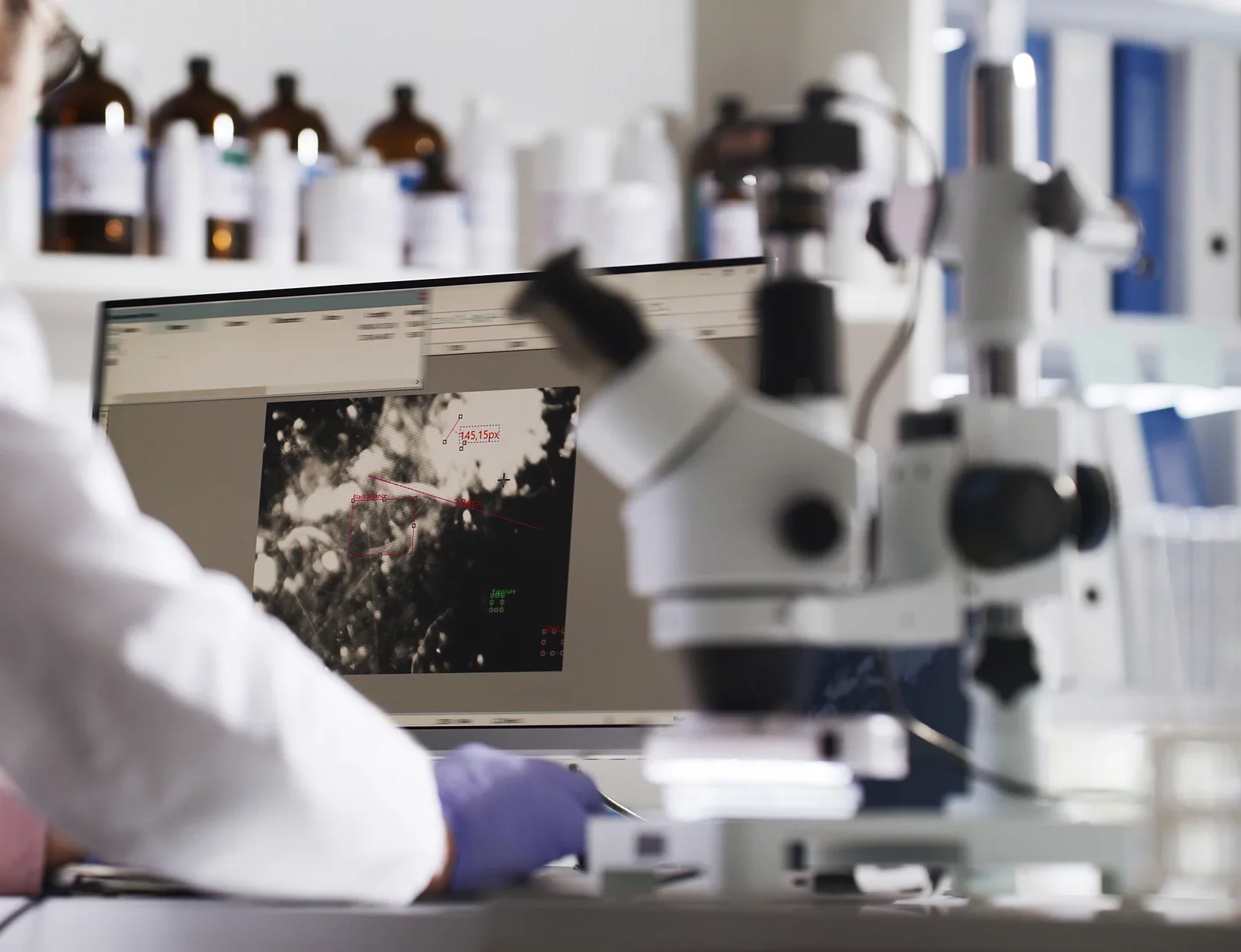 A person using a computer in a laboratory